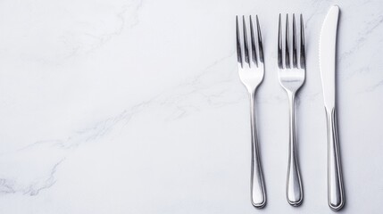 Elegant silverware on marble; place setting; restaurant background; menu design
