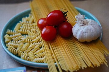 Pasta, food and tenge banknotes on the table.