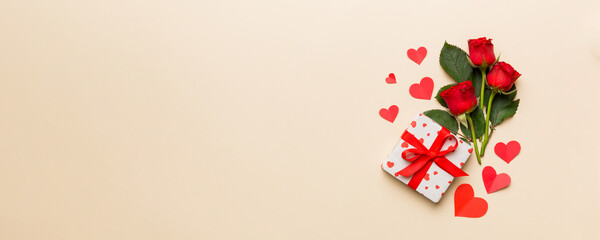 Valentine's day composition with rose flower, red heart and gift boxes on table. mother day and...