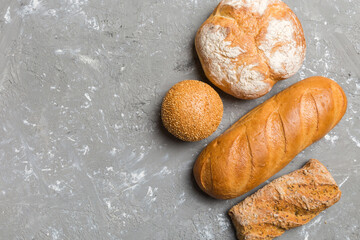 Homemade natural breads. Different kinds of fresh bread as background, top view with copy space