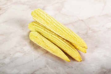 Raw sweet baby corn heap