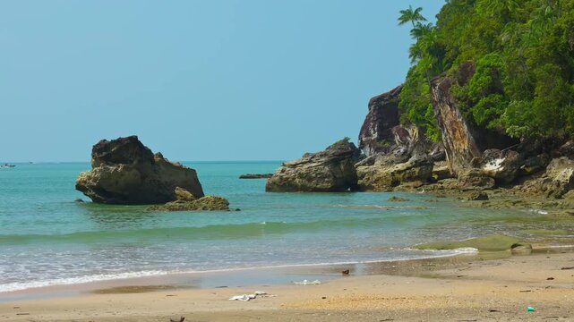 Handheld shot of a tropicial beach and shallow ocean