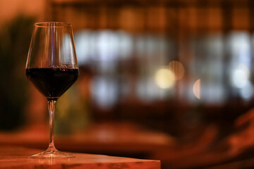 A glass of red wine is a beautiful background for serving