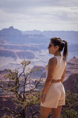 Close-up of unrecognizable young woman, while visiting the wonderful Grand Canyon of the Colorado River, in the United States.