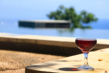 A glass of red wine is a beautiful background for serving