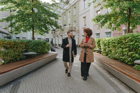 Business coworkers walking in business park