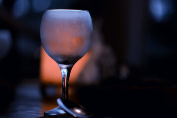 A glass of white wine on a blurred abstract background, alcohol, relaxation