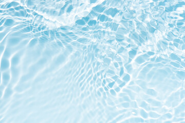 Blue water with ripples on the surface. Defocus blurred transparent blue colored clear calm water...