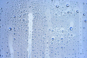 drops glass blue background abstract, transparent cold background water splashes