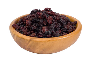 Dried raisins in a wooden bowl isolated on white background.