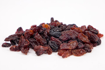 Dried raisins on a white background. Close-up. Selective focus.