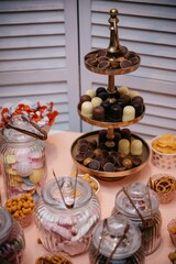 Elegant dessert table with chocolates and sweets.