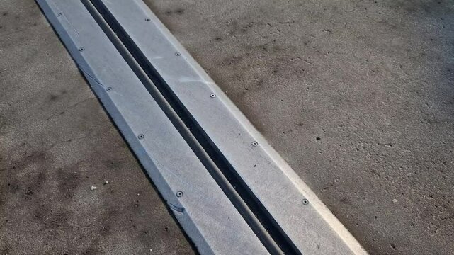 roof structure or bridge expansion for safe connection of two expandable concrete bodies. rubber joint in a metal bar