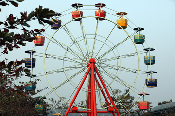 Wonder wheel in an amusement park.Ferris wheel.Ferris wheel on sky background in amusement park