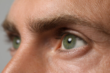 Closeup view of man with green eyes