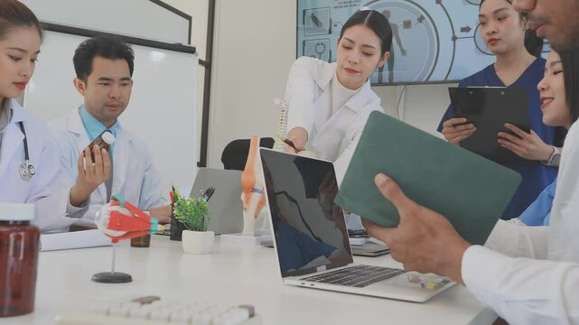 Asian medical team meeting About rickets and human internal organs, medical health concept