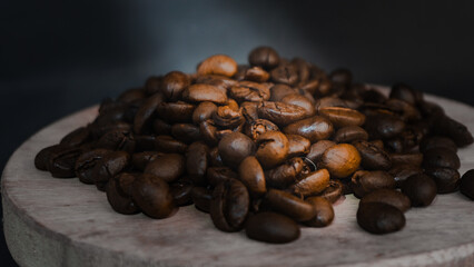  Roasted coffee beans are blackish brown, with a black background