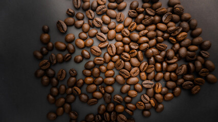  Roasted coffee beans are blackish brown, with a black background