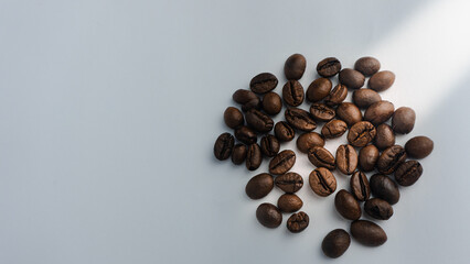  Roasted coffee beans are blackish brown, with a white background