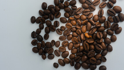  Roasted coffee beans are blackish brown, with a white background