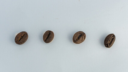  Roasted coffee beans are blackish brown, with a white background