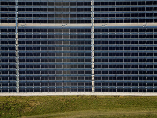 Obraz premium extensive roof of industrial and logistic hall are gradually being filled with solar panels. covering roofs helps industrial developer increase energy efficiency and sustainability site, building 