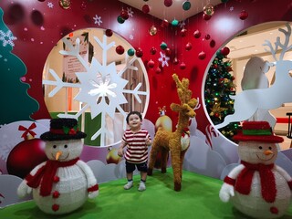 Cute, lovely, innocent baby boy celebrating Christmas 