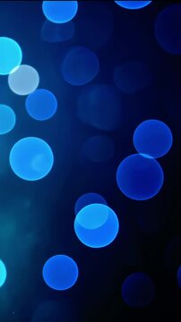 Abstract blue bokeh background with soft circles creating a dreamy atmosphere for design use