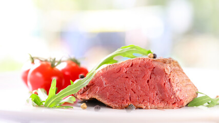 Grilled Beef Steak on a Plate with Salad and Tomato