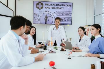 Fototapeta premium A diverse team of health care professionals, including doctors and nurses, sit and talk in a hospital office. The team works together to provide expert medical care and support to patients.