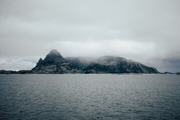 A Misty Island Landscape featuring Clouds and the Ocean, embodying tranquility and beauty