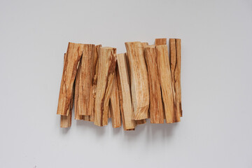  wooden palo santo sticks on a white background 