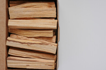 incense palo santo sticks wooden in a box on a white background flat lay copy space