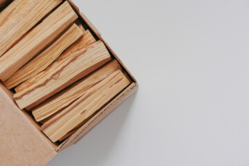 incense palo santo sticks wooden in a box on a white background flat lay copy space