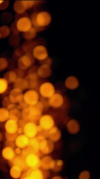 Glowing orange bokeh lights creating a warm atmosphere against a dark background, ideal for festive themes