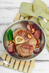 Ossobuco beef meat with spices and fresh herbs. Veal shank steak, traditional Italian ingredient