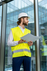 Young male engineer scrutinizing new project scheme and looking determined