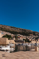 DUBROVNIK, Croatia Defensive walls of the old city of Dubrovnik. View of the modern city which is opposite the old town. Vertical photo