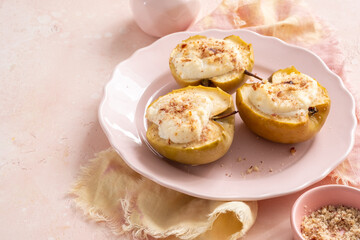 Three apple pies with whipped cream on a pink plate