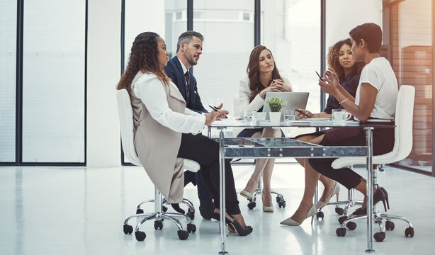 Laptop, team and business people in discussion, meeting and pitch ideas in office. Group, operations manager and planning project for sales budget, collaboration and proposal for problem solving