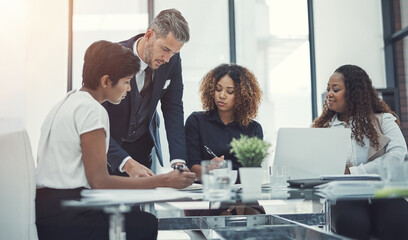 Planning, finance or business people in meeting with project for feedback, discussion or teamwork. Corporate report, writing or financial advisor talking to economists for economic analysis together