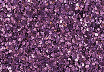 A glistening purple glitter texture radiating festive energy with its dazzling sparkle and vibrant hue.