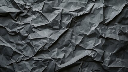 Abstract crumpled dark gray paper texture