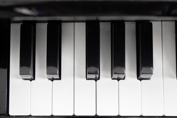 Naklejka premium Classic piano black and white keys. Top view, flat lay. Close up