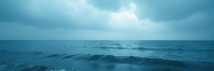 Fototapeta premium Overcast sky, deep blue sea Muted light, gentle waves , vast, reflection