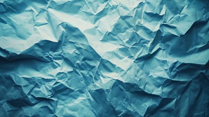 Obraz premium Crumpled blue paper abstract background.