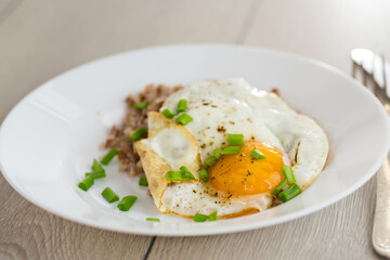 Appetizing dish with egg and boiled buckwheat
