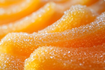 Sugary orange gummy candies with sparkling sugar coating