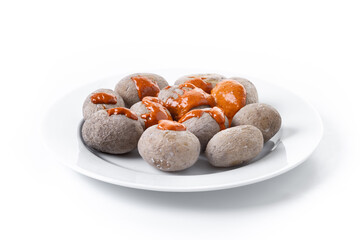 Papas arrugadas with mojo sauce isolated on white background. Traditional Canary Islands food.