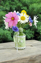 Sommer flowers, daisy and marguerite  in vase. Holiday card. 